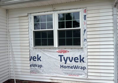 Window in the middle of siding being replaced